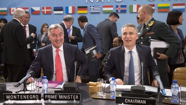 NATO Secretary General Jens Stoltenberg, right, and Montenegro's Prime Minister Milo Dukanovic, left, take their seats during a meeting of the North Atlantic Council and Montenegro at NATO headquarters in Brussels on Thursday, May 19, 2016 - Sputnik Türkiye