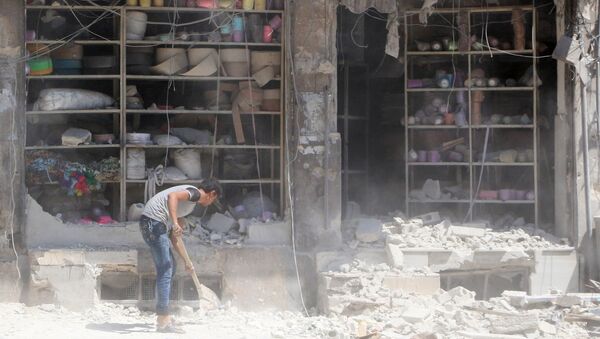 Suriye'nin Halep kentinin El Katerji mahallesine düzenlenen saldırının neden olduğu yıkım - Sputnik Türkiye