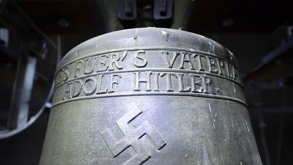 Church bell with the inscription Everything for the fatherland Adolf Hitler and a swastika is pictured in the town church in Herxheim am Berg, western Germany. (File) - Sputnik Türkiye